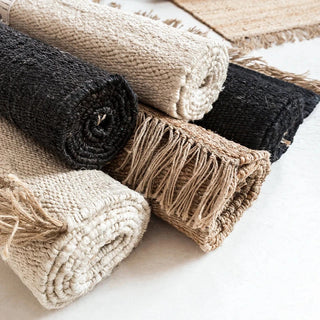 Handwoven rugs made from natural jute, wool, cotton, and linen for minimalist, boho, and modern homes.