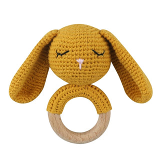 Blue crochet bunny teething ring made from organic cotton yarn and natural beechwood, eco-friendly and handmade for babies.