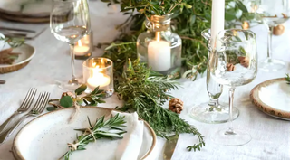 Arkaim Home – Christmas table styled with natural ceramics, linen napkins and earthy seasonal decorations