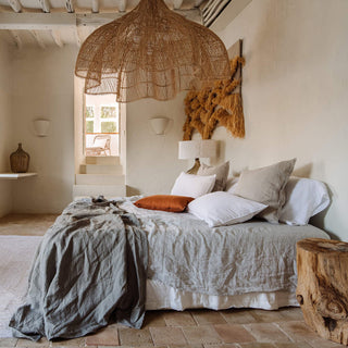 Arkaim Home – Earthy toned home interior with terracotta, warm beige and natural wood accents in a calm living space