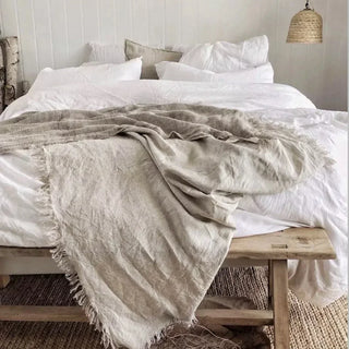 Calm bedroom styled with natural linen bedding, earthy tones and handmade homeware by Arkaim Home