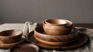 Collection of wooden bowls, platters, serving trays and boards, designed with natural materials for everyday dining.