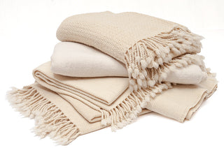 Natural white merino wool blankets and throws.