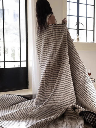 Hand-braided black and white jute and cotton rug. Sustainable, durable, and reversible—perfect for Japandi, Scandi, and minimalist interiors.