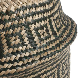 Handwoven seagrass basket with black tribal motif for boho or natural home storage and decor.