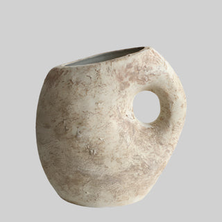 Nara handmade ceramic ornamental vase with an organic, asymmetrical shape and a textured clay finish with earthy undertones. The vase features a sculptural handle-like cutout and a rustic, wabi-sabi aesthetic. Perfect for Japandi, modern, and minimalist home décor.