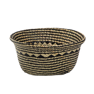 Handwoven natural and black seagrass storage basket with handles, perfect as a stylish hanging basket, pot planter, or decorative storage solution. This eco-friendly, two-tone basket with a tribal motif adds a boho touch to your home décor while keeping your space organized. Shop handcrafted storage baskets at our natural homeware store.