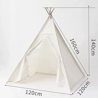 Large whimsical cotton teepee play tent with pom poms for children. Boho-style play tent for nursery or bedroom.