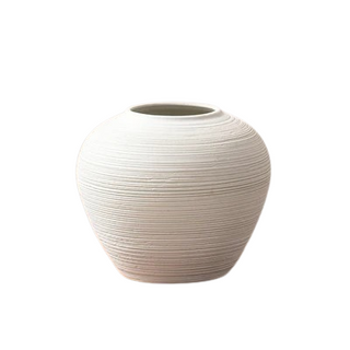 White ribbed ceramic minimalist vase – a stylish decorative ornament perfect for modern and zen-inspired home decor. The Bo textured round vase adds an elegant touch to any space, ideal for coffee tables, shelves, or mantel displays. A must-have home accessory for a natural and contemporary aesthetic.