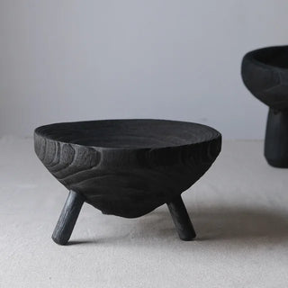 Black handcrafted wooden decorative bowl with tripod base, made from sustainable tung wood-stylish centrepiece for minimalist, scandi and wabi-sabi interiors.