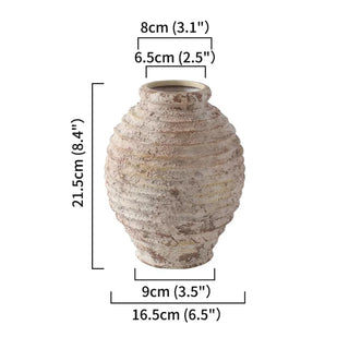 Ribbed Ceramic Vase, crafted from natural ceramic and finished in a distressed antique white wash. It adds depth and character to any setting. With its elegant silhouette and neutral tones, it complements a variety of arrangements, making it an ideal centre piece for both modern and traditional natural home décor. Perfect as a stand-alone ornament or paired with other decorative accessories.