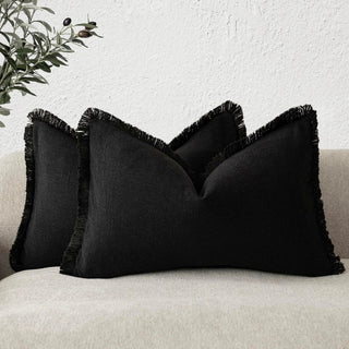 Black cotton cushion cover with fringe edge – modern minimalist style.