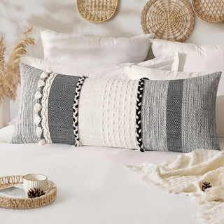 Handwoven cotton lumbar cushion cover with green striped detailing and tassel fringe—ideal for boho or contemporary living spaces.