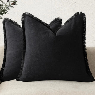 Black cotton cushion cover with fringe edge – modern minimalist style.