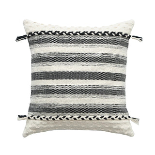 Handwoven Mara Cotton Cushion Cover with black textured stripes, fringe tassels, and a soft, breathable fabric. Ethnic-inspired design, perfect for boho, modern, and rustic home décor.