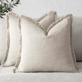 Ivory fringed cushion covers, made from 100% natural linen cotton blend for a soft and breathable feel. Featuring elegant ruffled edges, these timeless cushion covers are available in two sizes for flexible styling in any home décor.