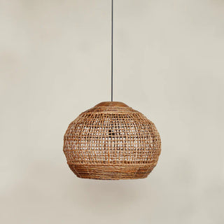 Handwoven abaca pendant light with rounded shape and reclaimed teak top—natural, organic lighting for contemporary interiors.