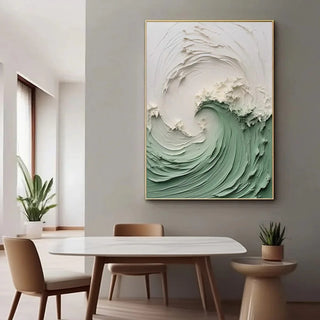 Abstract ocean wave canvas wall art in green and white in a modern dining room setting.