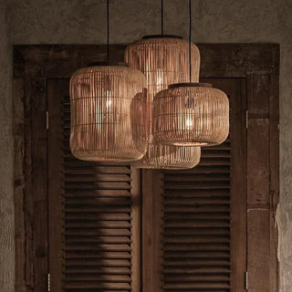 Natural rattan and teak pendant lights with organic shape — handmade ceiling lamp for minimalist or coastal interiors.