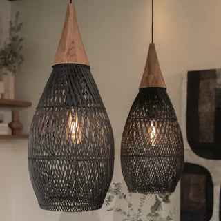 Black handmade rattan and teak pendant light with tear drop shape — artisan ceiling lamp for Wabi Sabi or Boho interiors.