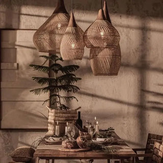 Natural handmade rattan and teak pendant light with organic shapes — artisan ceiling lamps for Wabi Sabi, Boho or coastal interiors.