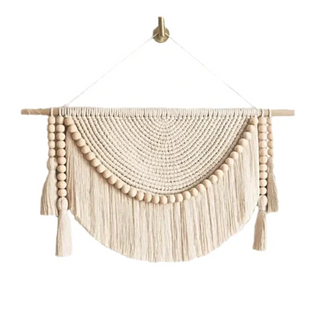 Handmade macrame wall hanging – a beautifully crafted natural home decor piece. Featuring intricate knot patterns and wooden bead tassel details, this boho-inspired wall art adds texture and warmth to any space. Perfect for modern, rustic, or Scandinavian interiors. Ideal for living rooms, bedrooms, or entryways. 