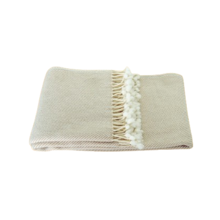 Fine merino wool blanket in beige and white-natural soft throw for stylish, modern interiors.