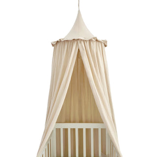 Cream cotton nursery canopy with a conical top and draped fabric, ideal for creating a cosy reading nook or dreamy play space in a child's room.
