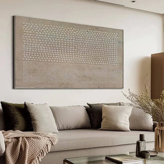 Panoramic textured wall art in neutral beige tones styled above sofa in modern living room.