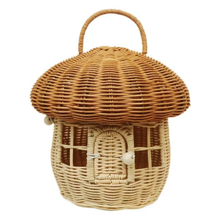 Handwoven rattan mushroom-shaped basket with arched door and handle, designed for children's toy storage and whimsical nursery decor.