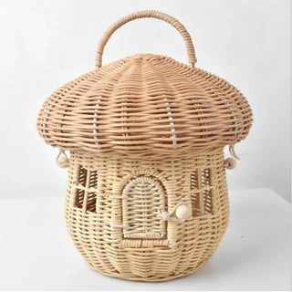 Handwoven rattan mushroom-shaped basket with arched door and handle, designed for children's toy storage and whimsical nursery decor.