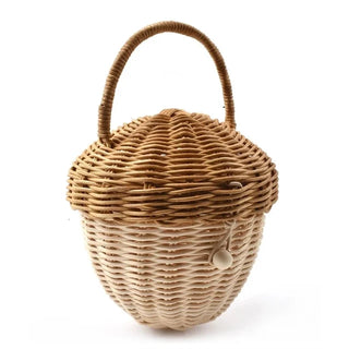 Natural rattan wicker pine cone basket with lift-top lid and handle, designed for children’s storage, play, or nursery decor.