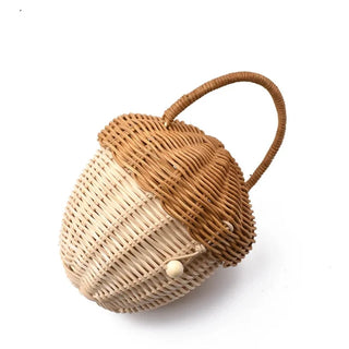 Natural rattan wicker pine cone basket with lift-top lid and handle, designed for children’s storage, play, or nursery decor.