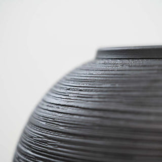 Black ribbed ceramic minimalist vase – a stylish decorative ornament perfect for modern and zen-inspired home decor. The Bo textured round vase adds an elegant touch to any space, ideal for coffee tables, shelves, or mantel displays. A must-have home accessory for a natural and contemporary aesthetic.