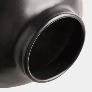 Black ceramic sculptural vase with a minimalist design, available in two sizes that can be styled together. The vase features a creative, artistic shape and a sleek black finish, perfect for adding a bold, statement look to any modern or contemporary interior.