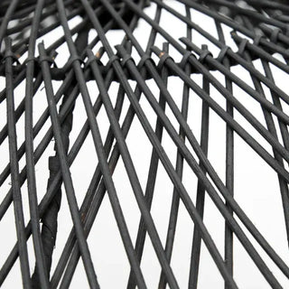 Black handwoven rattan pendant light with dome-shaped silhouette and airy open weave.