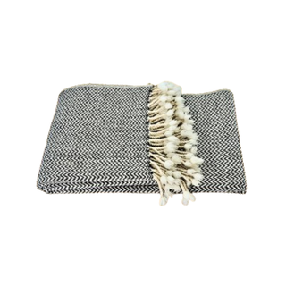 Black and white zigzag fine merino wool blanket, soft throw for modern interiors, Arkaim Home.