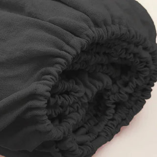Black pure linen fitted sheet — breathable natural linen bedding, textured and soft, ideal for year-round comfort. Available in multiple colours and sizes at Arkaim Home. Perfect for modern, boho, Scandinavian, and wabi-sabi bedroom styles.