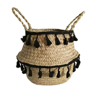 Handwoven natural seagrass storage basket with handles, perfect as a stylish hanging basket, pot planter, or decorative storage solution. This eco-friendly basket, adorned with charming tasselled fringe, adds a natural boho touch while keeping your space organized. Shop handcrafted storage baskets at our natural homeware store.