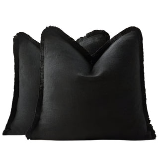 Black cotton cushion cover with fringe edge – modern minimalist style.