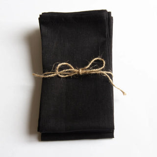 Black linen table napkins for minimalist table setting.