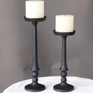 Nordic-inspired black iron candle holders for minimalist home décor.