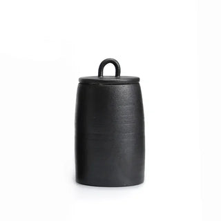 Black Japanese stoneware storage jar with lid, featuring a rustic finish. Perfect for kitchen organization, this ceramic canister provides airtight storage for tea, coffee, spices, or pantry essentials. A stylish and functional addition to natural homeware and minimalist décor.