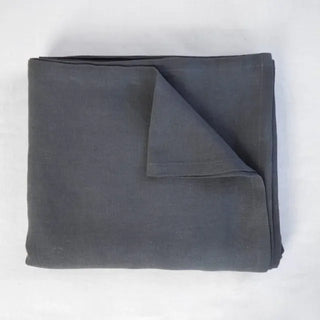 Black pure linen flat sheet and 2 pillowcases set. Available in a range of neutral colours and sizes from Arkaim Home. Natural linen is breathable, textured, and perfect for relaxed year-round comfort. Great for modern, Boho, Scandi, wabi-sabi bedroom interiors.