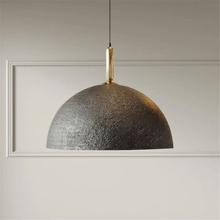 Black metal dome pendant light with textured matte finish hanging for modern, minimalist and Scandi interiors.
