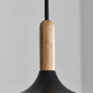 Black minimalist pendant light with a wooden accent.