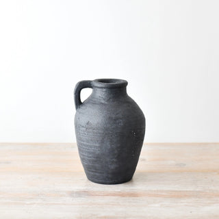 Black terracotta jug shaped vase with rustic matte texture and loop handle for modern, minimalist and rustic interiors.