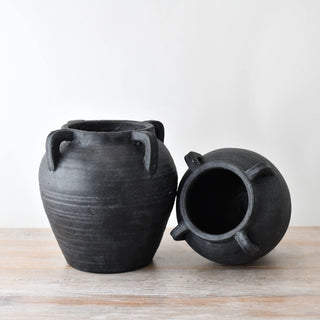 Black urn-shaped terracotta vases for styling in modern, minimalist ad rustic interiors.