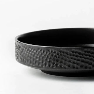 Black embossed ceramic deep plates in white, and black from the Suki collection by Arkaim Home. Ideal for ramen, pasta, salad and fruits.