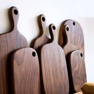 Collection of solid black walnut chopping or serving boards in various shapes and sizes, Arkaim Home